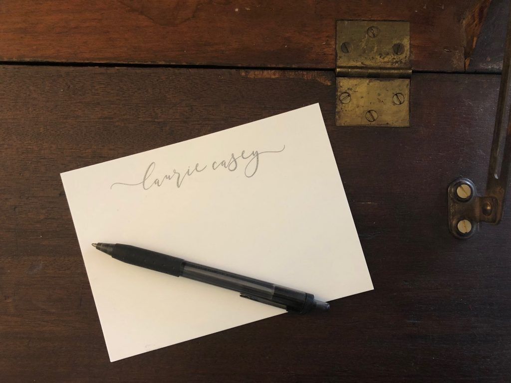 Personalized stationery and pen on writing desk